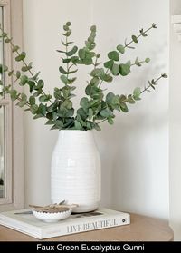 This incredibly lifelike faux green Eucalyptus Gunni is perfect for a variety of arrangements and adds a stunning touch to any vase. Its real touch texture is unmatched and it truly stands out as the most authentic faux Eucalyptus on the market. 11 x stems styled in our Hemingstone vase.  Also shown with 5 x stems of White Limonium.  Our stems can easily be moulded and bent to size, or trimmed with wire cutters. Price is per stem.  Dimensions: H