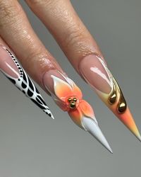 Make a statement with bold coffin nail designs. These nails feature striking colors and patterns, perfect for showcasing your confident and daring style.