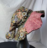 Looking for a unique gift or something fun for yourself? This may be right up your alley! A fun dark floral witch hat that is sure to turn heads would make a great addition to your cosplay or everyday. Made from cotton it is approximately 11.5 laid flat 23 in around.