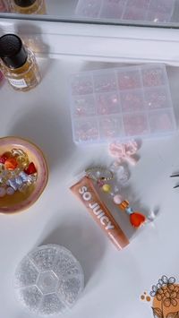 Saw this all over TikTok and wanted to try it 😶‍🌫️#charm #charms #phonecharm #phonecharms #beads #beadsbeadsbeads #beadsjewelry #beadswork #keychains #keychain #lipgloss #aesthetic #pinterest #pinterestaesthetic #beadedjewelry