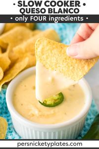 Slow Cooker Queso Blanco (aka white queso dip) is made with just four ingredients and no Velveeta! Restaurant quality made in just minutes in the crockpot. | www.persnicketyplates.com