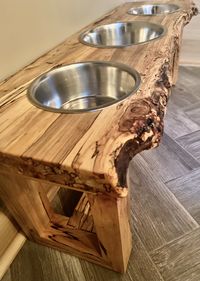 This live edge raised feeding stand or water stand fits bowls perfectly in place, straight cut in the back to sit nicely against the wall, (we also make sure the legs sit in a bit to avoid bumping against floor trim), and offers a very unique decor to your home. These stands work for dogs or cats.🐾 Your furry family members can eat and drink in style just like you! In this collection you will find general sizes, but we can create any size! Just tell us the space you're working with for length,