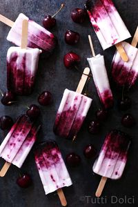 Sweet and creamy cherry Amaretto popsicles made with fresh cherries and flavored with Amaretto and almond extract.