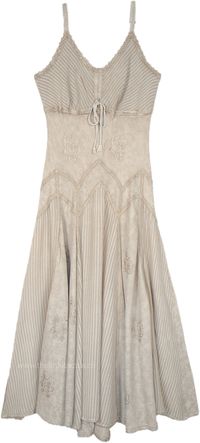 A summer maxi dress in beige with lace details around the neckline and hem, this sleeveless dress has vertical panels that add flair and feminine flow to it. The front of the dress has a tie-up lace style. #tlb #Sleeveless #SummerDress #westerndress #renaissancedress #medievaldress