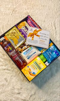 A gidt box containing care items to make gloomy period days easier