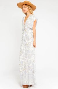 The adorable Billie Blue Paisley Print Wrap Maxi Dress is always going to be your go to! Beautiful ivory, blue, and orange paisley print woven rayon shapes a V-neckline and very short dolman sleeves. Wrap bodice, with tie sash, tops a matching maxi overlap wrap skirt.