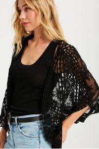 The Vega Black Floral Lace Kimono Top can take it from dinner at a friends, to a night out! Sheer black embroidered lacer creates this lovely top. Wide, kimono sleeves, a tapered open-front design, and crochet trim detail complete this beautiful short coverup.