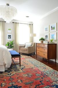 This is probably my current favorite bedroom on the internet. I love the peaceful neutrals set off accent the bold rug. I like the mix of textures and old and new furniture.