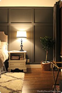 Adding a dark gray accent wall and board and batten to the master bedroom creates something amazing. #DIY #accentwall