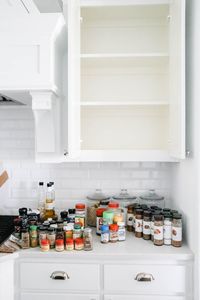 A before and after on how to purge a spice cabinet and the best organization products to use. #spicecabinet #kitchen #organization #ABlissfulNest