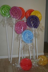 OMG, I love these! ~ Swimming Pool Noodle "Candy"-great for Christmas candy yard decorations! (get noodles now, in summer!)