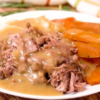 This Crock Pot Pork Roast is an easy dump and go dinner idea that's perfect for busy weeknights! There is plenty of delicious gravy that pairs perfectly with mashed potatoes! #crockpot #porkroast #gravy #easydinner