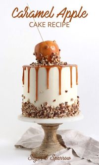 The perfect cake for Fall: layers of apple spice cake, salted caramel, and vanilla buttercream, topped with a dripping caramel apple | Sugar & Sparrow | #caramelapples #caramelapplerecipe #caramelapplecake #cakerecipe #fallcake #applecake #saltedcaramel #caramelrecipe