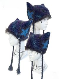 Featuring adorable cat ear shapes adorned with star motifs, this beanie is perfect for keeping you snug and on-trend. Complete with two long tails for added flair, it's the perfect accessory to elevate your winter wardrobe. Embrace the magic of the season with this enchanting addition to your wardrobe, where every wear promises a delightful touch of playful elegance. Hand knit over the course of 4 hours. Polyester & 10% Wool Washing Instructions:Can be washed in low-temperature water and ironed