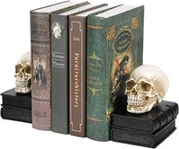 This pair of antique inspired skull on books bookends is a great gift idea for the modern goth loving individual or pick up for yourself to use as seasonal decorations for Halloween. Constructed of polyresin material, the intricate vintage style skull on black stacked books makes for striking ornamental displays. The sturdy bases are excellent book support holders that double as unique decorative office paperweights to use year-round. Eye-catching pieces of gothic décor, these meticulous sculptu