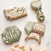 Sara Zoeller on Instagram: "Baby in blooooooom🌿🌿🌿🌿🌿🌿. . . This sweet soft color palette was dreamy to work with and I loved making these for such a lovely customer! Shout out to those repeat customers- you make my heart sing! . . Cutters: Floral hexagon and floral plaque @night.owl.icing Crib @charlson_cookieco Wonky onesie @kaleidacuts Rattle @annclarkcookiecutters Booties handcut . . #babyinbloom #babyshower #babyboy #babyshowerideas #babyshowercookies #babycookies #floralcookies #floral