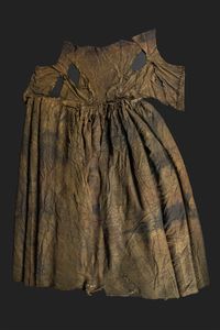 this 17th-century gown was recovered from the so-called 'palmhoutwrak' (boxwood wreck), located to the east of texel island in the dutch wadden sea | fashioned from a light-coloured silk that has discoloured over the centuries, it features elaborate silver embroidery in a loveknot pattern and is believed to be a wedding dress | despite having been buried beneath the waves for almost four centuries, it remains in extraordinary condition | museum kaap skil, oudeschild, texel