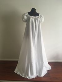 This chemise is the perfect summer under dress for any renaissance or regency era ensemble! The ultra-full gown is an A-line design that reduces bulk at the top but is full enough to float over a full hoop-slip! The fabric is a breathable cotton blend washable fabric and will be just the touch to your existing wardrobe. Over 5 yards of 100% cotton fabric go into this amazing chemise! The neckline is elasticized and can be pulled low off the shoulders. The short sleeves measure 4 inches from unde