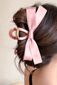 This Ribbon Bow Hair Clip adds the perfect touch of charm and style to your hair. Made from high-quality ribbon, it is both durable and comfortable to wear. The elegant design and vibrant colors are sure to make you stand out and make any outfit look even more special. Material: plastic