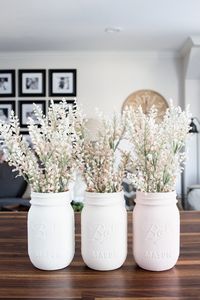 DIY pastel painted mason jar vases. Find this and many other up-cycle projects at 50 DIY Farmhouse Interior Decor Ideas! #diydecoratingideas