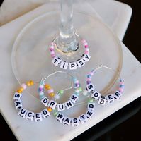 Say goodbye to losing track of your wine glass (no matter how tipsy you are)! These funny wine charms can be customized to say anything - as long as it's 6 characters or less - Just message me what you're wanting! Perfect Hostess Gift essential for any social gathering. 🥂Comes as a set of 5 🥂Small storage bag included 🥂If not specified words include: Drunk, Tipsy, Wasted, Sober, Sauced 🥂For use with stemmed glasses only