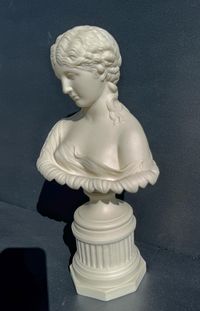 Own a piece of classical elegance with this beautifully detailed antique parian ware bust of Clytie, a captivating figure from Greek mythology. This fine parian bust stands as a stunning decorative statement for any home or collection. About Clytie: In Greek mythology, Clytie was a water nymph who fell in love with the sun god, Helios. However, her love was unrequited, and she was abandoned by Helios. Heartbroken, she spent her days gazing at the sun, following its path across the sky. In her so