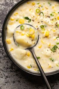 This vegan corn chowder is creamy and hearty and made with potatoes for a rich and comforting soup. A perfect appetizer or main course. | lovingitvegan.com