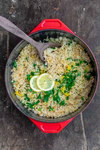 Greek lemon rice made with onions, garlic, fresh lemon juice and herbs! This is an easy side dish and pairs beautifully with lots of Mediterranean favorites including Souvlaki, Shrimp, and