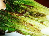 Roasted Romaine Hearts - 1 Romaine lettuce heart, Olive oil spray, Salt and pepper  -  Heat oven to broil on high.  Lightly spray a baking sheet with olive oil.  Slice Romaine heart down the center lengthwise.  Open it up and place on the baking sheet.  Spray with olive oil and season lightly with salt and pepper.  Broil for 5-8 minutes, depending on how hot your broiler gets.  The lettuce should be browned in spots but not burnt.  Dress as you wish and enjoy!