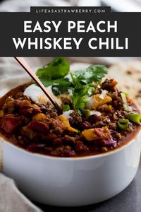 Peach Whiskey Chili - This easy homemade beef chili recipe is a perfect twist on a classic! Fresh peaches and a splash of whiskey or bourbon lend incredible flavor to this dish. Swap chicken or turkey for the beef, or use extra beans instead of meat for a delicious vegetarian version! Top with sour cream, cilantro, and your favorite chili toppings for a bowl of cold weather comfort food.