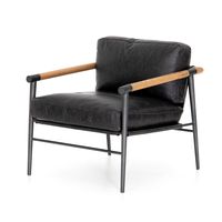 Buttery black seating of Four Hands-exclusive top-grain leather, with angular arms of exposed oak providing fresh contrast. Slim, carbon-finished steel legs for a dose of modern-industrial edge.