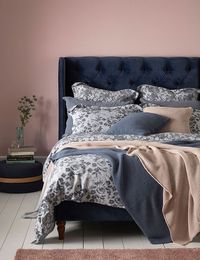 We love this bedroom style. A beautiful statement navy bed with our new beautiful Roses bed linen topped with soft knitted throws in blue and pink. We love to mix blush pink and blue and could spend a lot of Sunday mornings snoozing here. Made from the finest 100% cotton in Portugal.