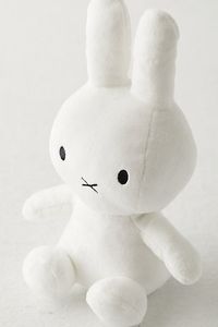 Our favorite bunny is ready for cuddles! This little Miffy plushie measures 10.5 inches tall with a seriously soft shell and polyester filling. Features Miffy-shaped plushie 10.5 inch silhouette is perfect for cuddling Versatile - use it to add a soft touch to your bed, sofa or shelves Content + Care Acrylic, polyester fill Spot clean Imported Size Dimensions: 5" l × 6" w × 10.5" h Weight: 0.3 lbs | Miffy 10-Inch Plushie in White at Urban Outfitters