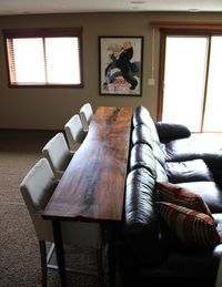 Media room with a bar to eat while watching a movie... this is SUCH a good idea!