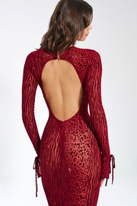 Meet Waylynn: a stunning sheer velvet burnout cheetah print maxi dress. This iconic piece features a sexy open back with silver shank button closures and stylish flare sleeves with ribbon tie detail. Crafted from high-stretch velvet burnout mesh, it hugs your curves in all the right places. Perfect for birthdays, nights out, vacations, and special occasions, available in a beautiful deep burgundy hue. Elevate your style and captivate the crowd with Waylynn.