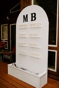 Champagne Wall + Built In Cooler Idea - Allows guest to have a drink at ceremony