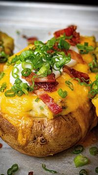 Dwight Smith on Instagram: "Twice Baked Potatoes 

You guys have to try this recipe!! Simple to make but big on flavour. Things the perfect holiday side dish for you and the family!!

Ingredients,

3 Russet potatoes 
1/4 cup heavy Cream
3 tablespoons Sour cream
2 tablespoons Butter
1/2 bunch Green onions sliced 
1 1/2 cups Cheddar cheese - grated 
5 strips Bacon
2 teaspoons Salt 
1 teaspoon Black pepper
2 tablespoons olive oil 

Method;

Rinse your potatoes under cold running water. Preheat oven to 400f. Place potatoes on a baking tray lined with parchment paper. Using a fork carefully make several holes through the skin of your potatoes. Coat them  with olive oil and sprinkle with salt, bake for 60-70 minutes depending on size. On a parchment lined baking tray lay out your bacon and bake 