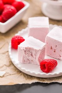 Healthy Raspberry Coconut Fudge made with @driscollsberry Organic Raspberries!  This fudge is naturally sweet, incredibly rich, smooth and uber coconutty, you'd never know it's refined sugar free, low carb, high protein and gluten free. No cooking required either! #RaspberryDessert