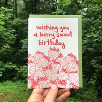 Brighten up your loved one's birthday with this cheerful "Berry Sweet" letterpress greeting card. The delicious home-grown strawberries bring warmth and cheer, while the pun adds a playful touch. As with artisan letterpress printing, you can be sure the quality of this card will make the recipient feel extra special. Hand-drawn images and typography are letterpress printed in vibrant red ink, paired with a green envelope. Please note the ink color may vary. This unique greeting card was printed