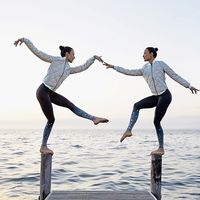 Dancing queens.  The @chintwins are featured in the Reflective Bomber & Airbrush Legging in Black Brillance. #aloyoga #beagoddess