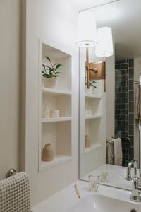 Traditional bathroom with wall niche at vanity