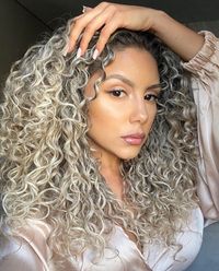 Long Layered Platinum Blonde Curl with Black Roots