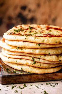 This Homemade Flatbread recipe is the carb you need right now. It's soft, fluffy, and super flavorful. A warm, soft, and fresh snack or dinner side. #bread #flatbread