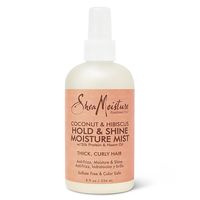 Style your curls in beautifully defined, frizz-free hairstyles with SheaMoisture's Coconut & Hibiscus Hold & Shine Moisture Mist. This gentle styling aid provides a soft hold to your waves and curls while delivering intense moisturization which tames stray flyaways and gives your hair an enviously brilliant shine! SheaMoisture's Coconut & Hibiscus Hold & Shine Moisture mist is gentle enough to be used on dry, sensitive hair. Blended with Fair Trade Shea Butter, neem oil and silk protein, this