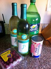 Summer Punch - 2 bottles Moscato, 1 can of pink lemonade concentrate, 3 cups of Sprite, 1 container of fresh raspberries