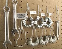 Shower curtain for nuts and washers. #organized #garage #storage #organization