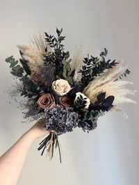 ❤❤Product Description ❤❤ If you are looking for muted and moody colours for your wedding, here you go! Our new collection Nightfall is just for you! These colours are so special and unique! Nightfall bridal bouquet includes: pampas grass, preserved roses, parfavolia, eucalyptus, Italian ruscus, and hydrangea. This bouquet is hand-tied with natural dried and preserved flowers. Each bouquet is unique and may vary from each other.  Dimensions:  Bridal bouquet (L) 16" (H) 16"(w) Bridesmaid bouquet 1