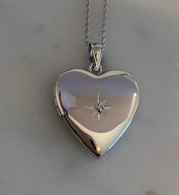 "Diamond Heart Locket in Sterling Silver, * 3/4 Inch Pendant * Holds 2 Photos * Solid 925 Sterling Silver, NOT Plated * Chain in 6 Lengths, 16\", 18\", 20\", 22\", 24\", 30\" * Gift for Women: Mother, Grandmother, Daughter, Sister, Wife, Friend * Rhodium Anti-Tarnish Coating * Comes in Gift Box with Velvet Pouch Thank you for visiting HarperSilver! 🎁Packaging: This item comes gently packaged in a fabric pouch housed inside of a silver foil linen box with a silver bow. It is ready to present as