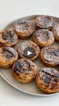 659K views · 1.5K reactions | Portuguese Custard Tarts 😍 aka Pastéis de Nata 🇵🇹 

Inspired by my recent trip to Porto, I’m really proud of this recipe. Most of the recipes out there are really complicated and time consuming. Here I’ve made it as simple as possible to create these most delicious little tarts! ✨ 

Here’s what you need to make them:

 50 g Plain flour
260 ml Whole milk
2 tsps Vanilla bean paste
6 Medium egg yolks
150 ml Water
250 g Golden caster sugar
1 Cinnamon stick
320 g Sheet of ready rolled puff pastry

To garnish (optional):
Icing sugar
Ground cinnamon

Check out my website for the full written recipe 🙌 
Have a go, and let me know how you get on! ❤️ | Jon Watts | Taylor Swift · I Can Do It With a Broken Heart