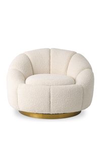 Con sus relajantes curvas y su tapizado bouclé suave al tacto, la silla giratoria Inger traerá opulencia a su hogar. Con el aspecto de una flor abierta, esta encantadora silla con detalles en color crema bouclé será un complemento muy decorativo para su salón o dormitorio. Está montado sobre una base giratoria de latón cepillado.     37 x 33 x 27 pulgadas (an. x prof. x al.) | Peso 73 libras  95 x 83 x 69 cm (anchura x profundidad x altura) | Peso 33kg  Dimensión del asiento: D23 x H17 in | 59